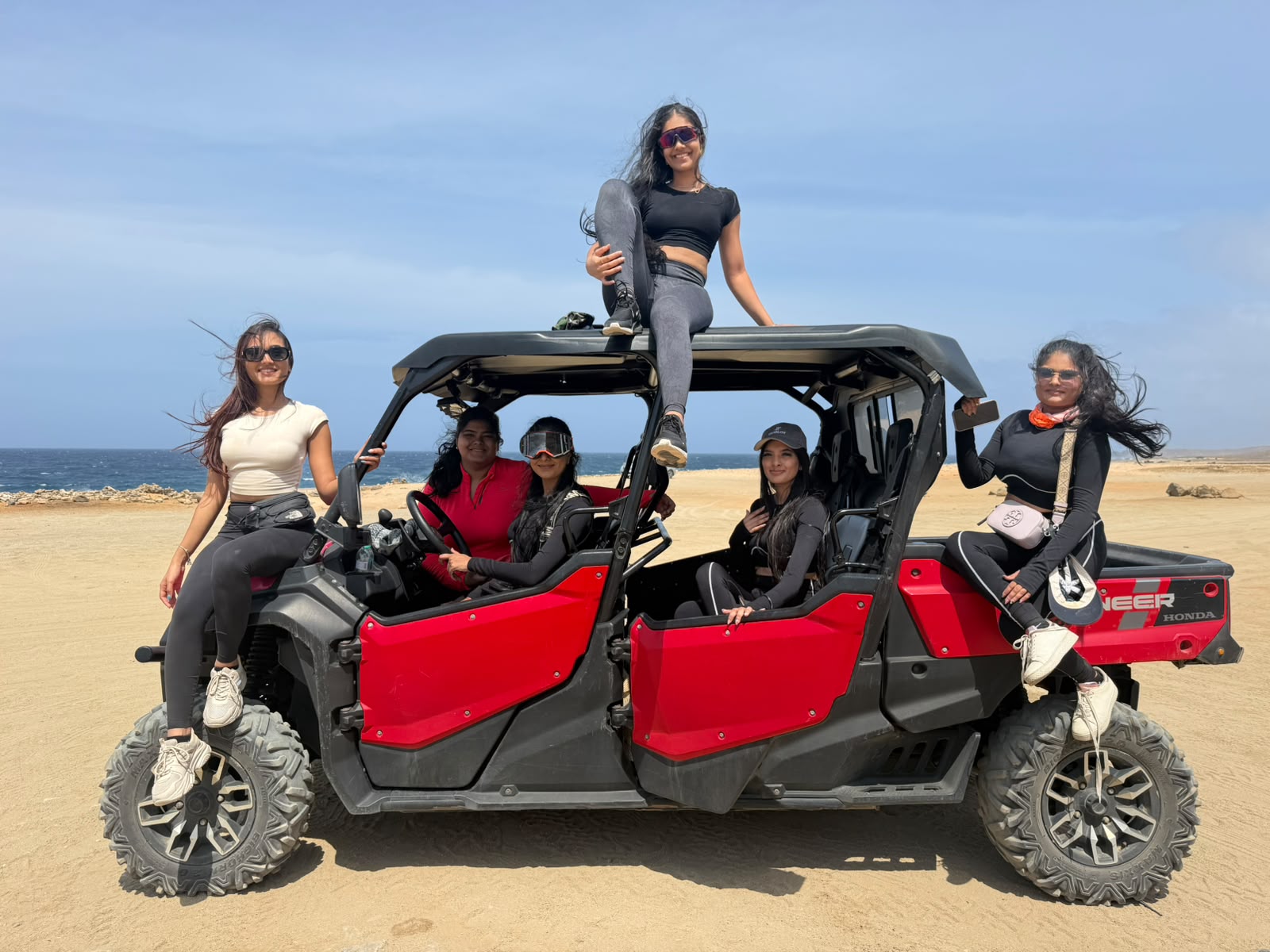 Guests with a 6-seat Honda Pioneer UTV on the north coast