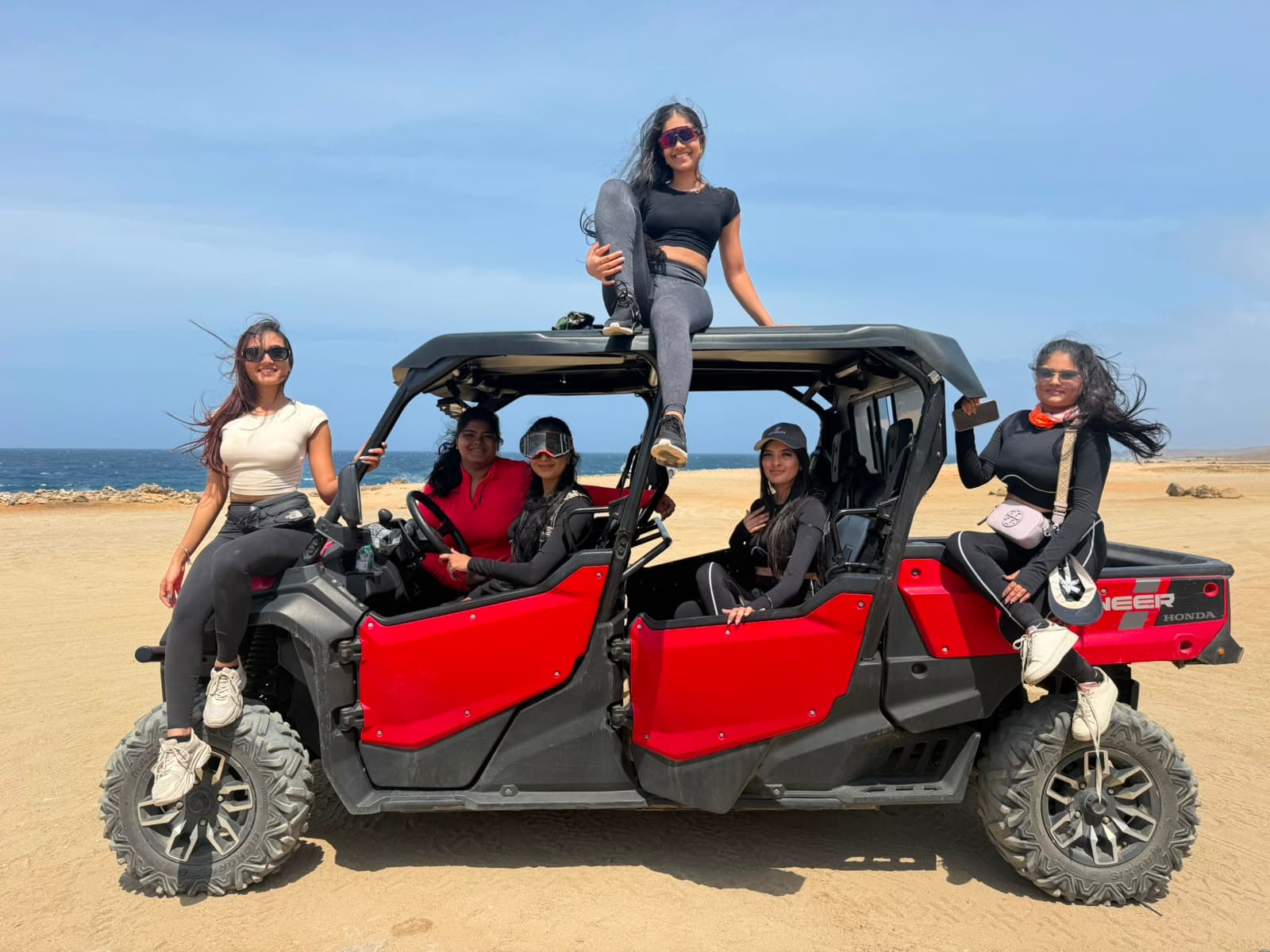 Guests with a 6-seat Honda Pioneer UTV on the north coast