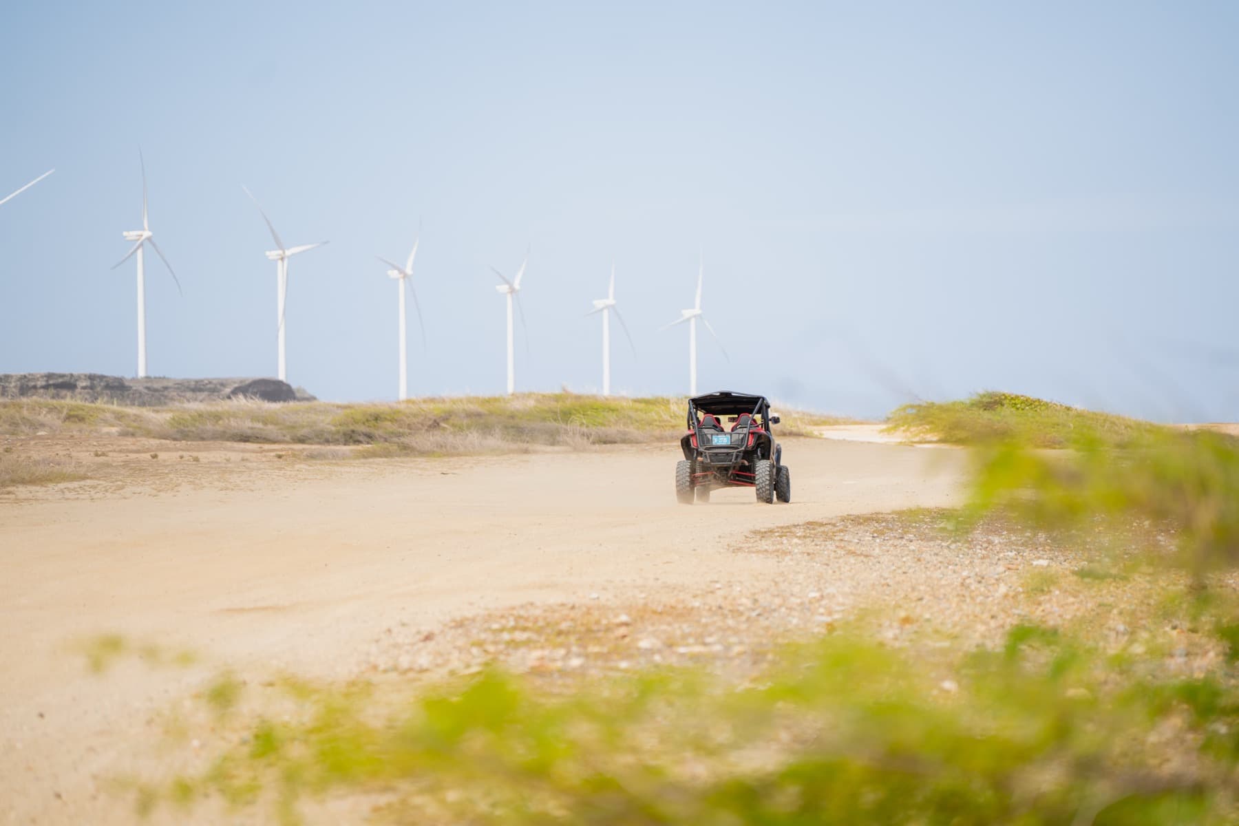 UTV passing the windmills on the north coast