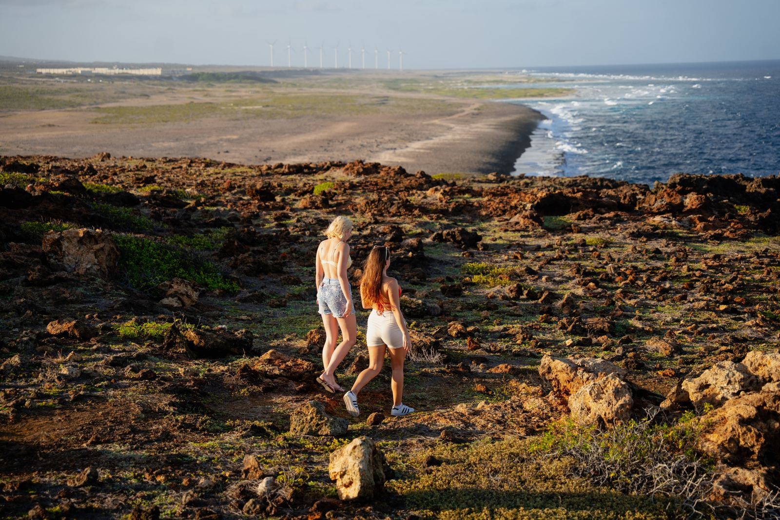 Walking the cliffs with the windmills beyond