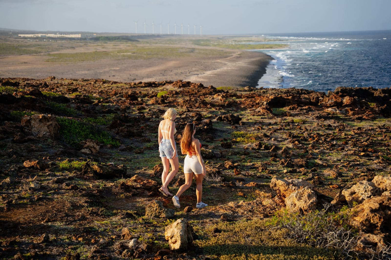 Walking the cliffs with the windmills beyond
